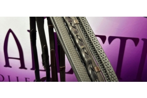 Close-up of Cavaletti Collection plaited leather reins and grip-textured stirrup leathers